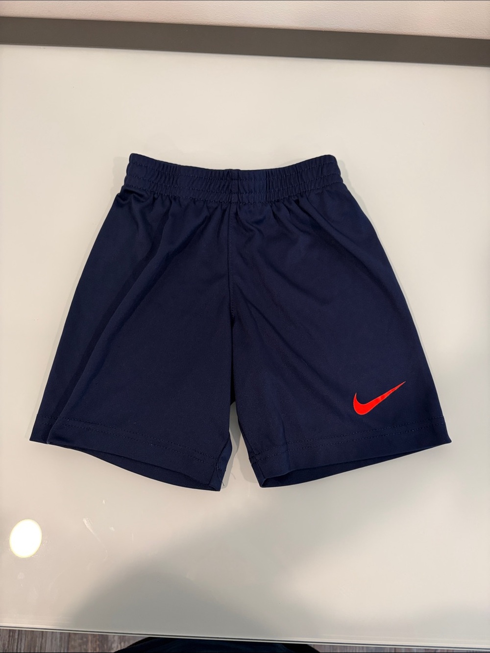 Nike Boys Navy Shorts with Red Swoosh Logo